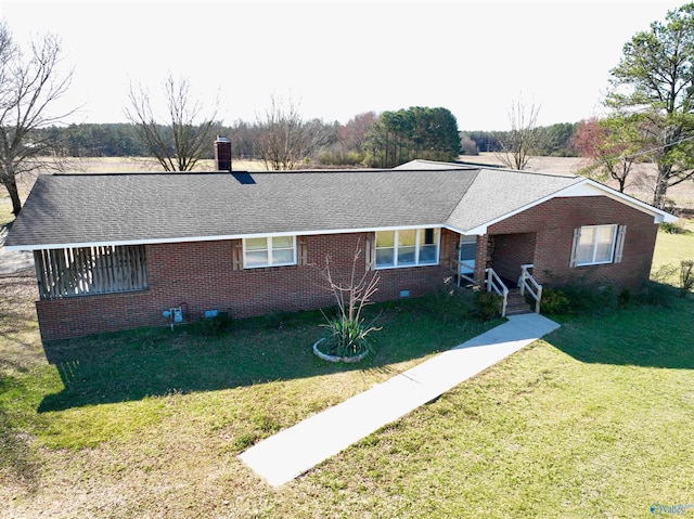 ranch-style home with brick siding, a chimney, a shingled roof, a front yard, and crawl space