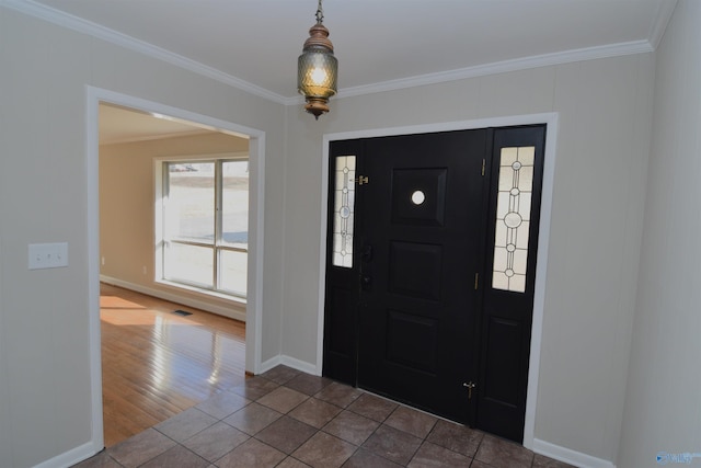 entryway featuring tile patterned flooring and ornamental molding