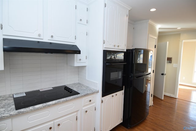 kitchen featuring white cabinetry, light stone countertops, dark hardwood / wood-style flooring, and black appliances