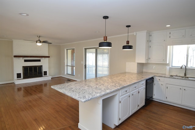 kitchen with white cabinetry, kitchen peninsula, sink, and dishwasher