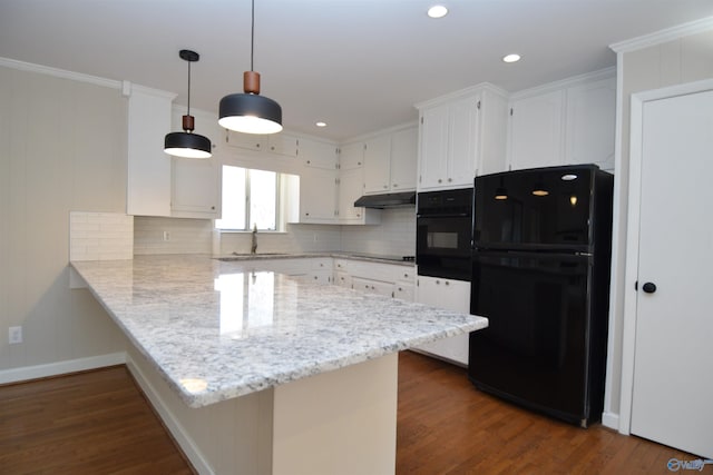 kitchen featuring white cabinetry, black appliances, dark hardwood / wood-style flooring, kitchen peninsula, and backsplash