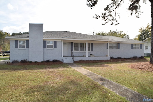 ranch-style house with a front lawn