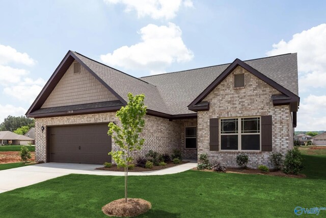 craftsman-style home with a garage and a front lawn