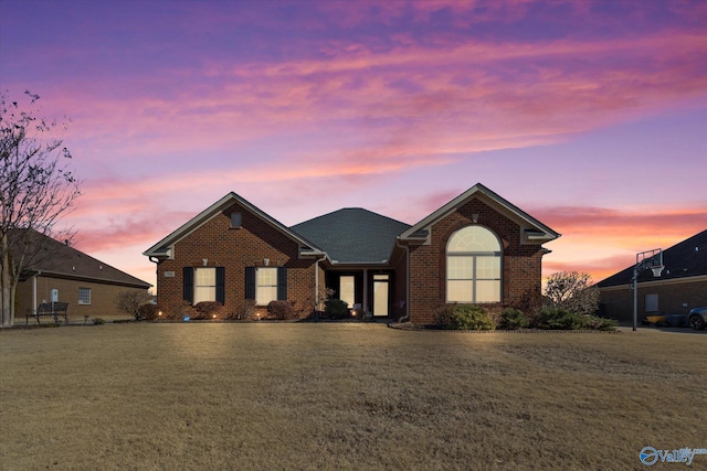 view of front of home with a yard