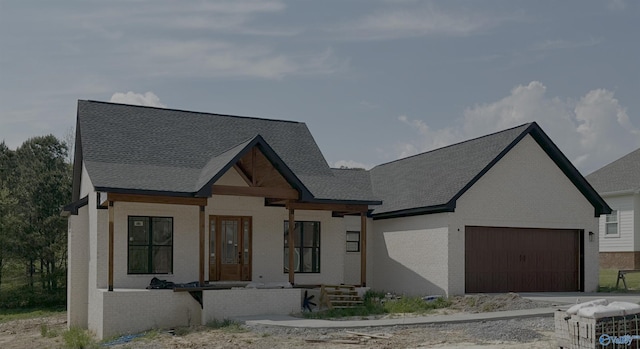 view of front of home with brick siding, an attached garage, and driveway