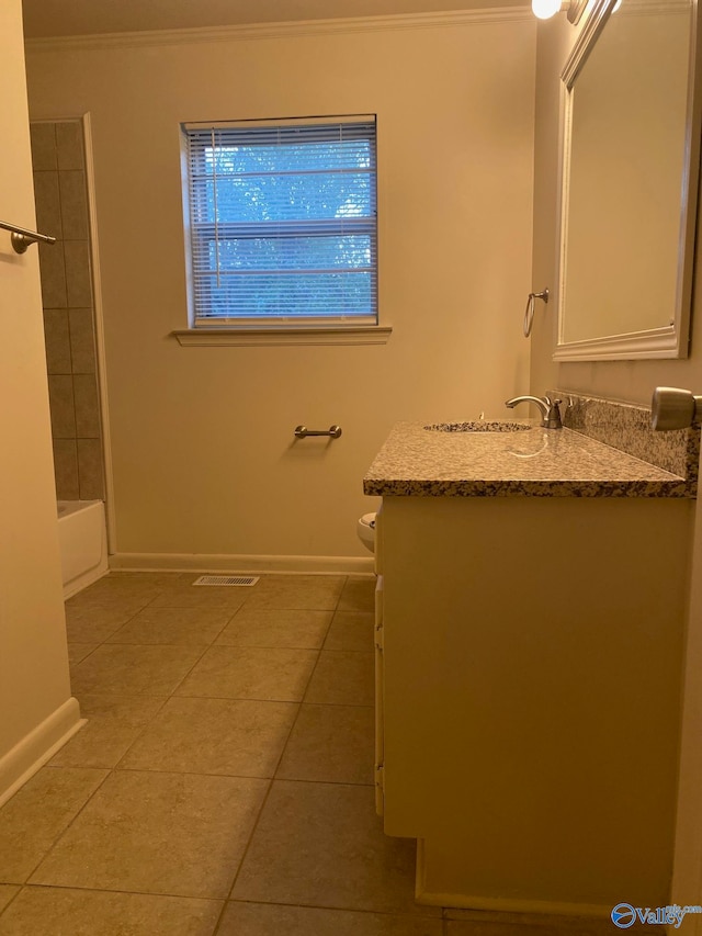 bathroom featuring ornamental molding, vanity, tile patterned flooring, and toilet