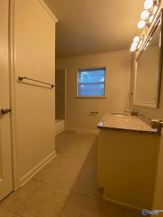 bathroom with ornamental molding, tile patterned floors, walk in shower, and vanity