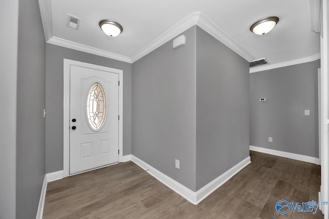 entrance foyer featuring crown molding and dark hardwood / wood-style floors