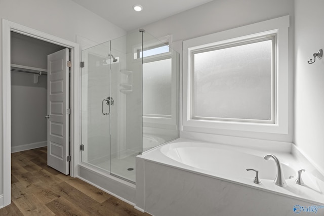 304 Wanto Ln, Huntsville, AL 35811 - full bath with a shower stall, a bath, a walk in closet, wood finished floors, and recessed lighting