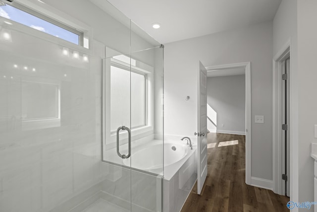 304 Wanto Ln, Huntsville, AL 35811 - bathroom featuring a bath, wood finished floors, and a shower with shower door