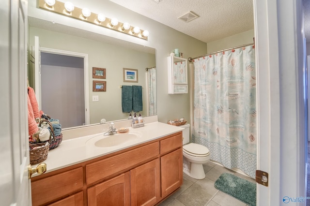 full bathroom with visible vents, toilet, vanity, tile patterned floors, and a textured ceiling