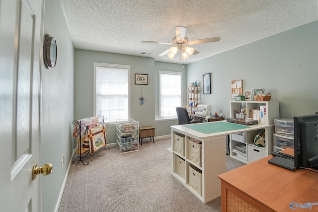 interior space featuring visible vents, light carpet, a ceiling fan, a textured ceiling, and baseboards