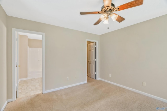123 Otter Trl, Huntsville, AL 35824 - unfurnished bedroom with light carpet, baseboards, and ceiling fan