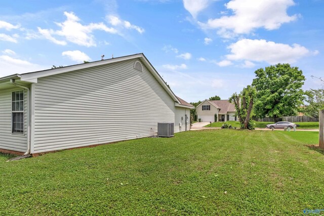 123 Otter Trl, Huntsville, AL 35824 - view of home's exterior with central air condition unit and a yard