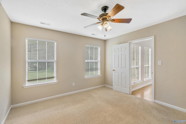 123 Otter Trl, Huntsville, AL 35824 - unfurnished bedroom with light colored carpet, baseboards, and multiple windows