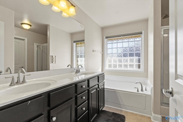 bathroom featuring vanity, shower with separate bathtub, and tile patterned flooring