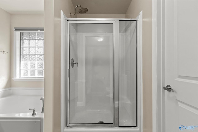 bathroom with shower with separate bathtub