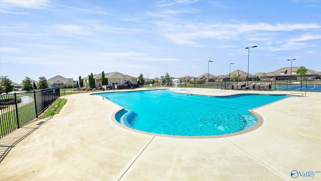 view of swimming pool with a patio area