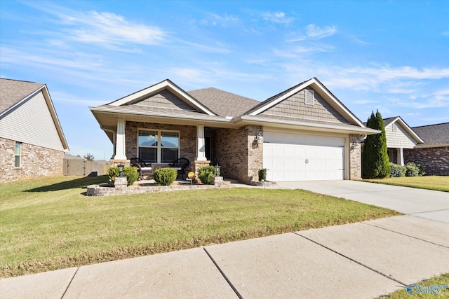 craftsman-style home with a front yard, a porch, and a garage