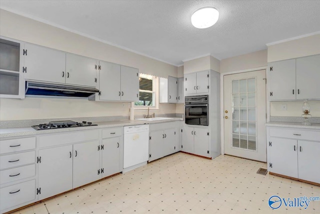 kitchen with white cabinets, dishwasher, black oven, and stainless steel gas cooktop