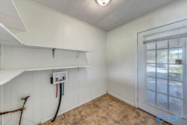 clothes washing area with hookup for a washing machine and ornamental molding