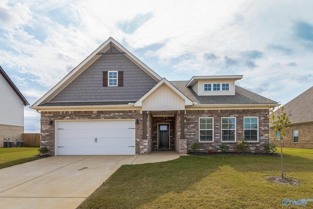 205 Roman Randall Rd, New Market, AL 35761 - craftsman-style house with brick siding, an attached garage, a front yard, and concrete driveway
