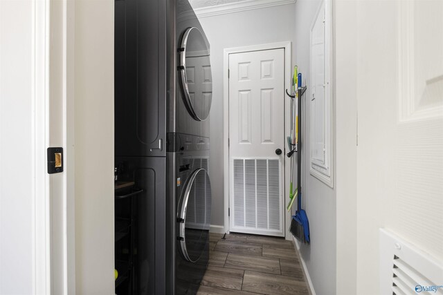 415 County Road 146, Leesburg, AL 35983 - washroom featuring laundry area, baseboards, dark wood-type flooring, and stacked washer / dryer