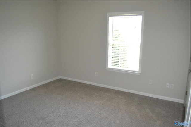 14 Moore Farm Cir NW Unit 14, Huntsville, AL 35806 - carpeted empty room with baseboards
