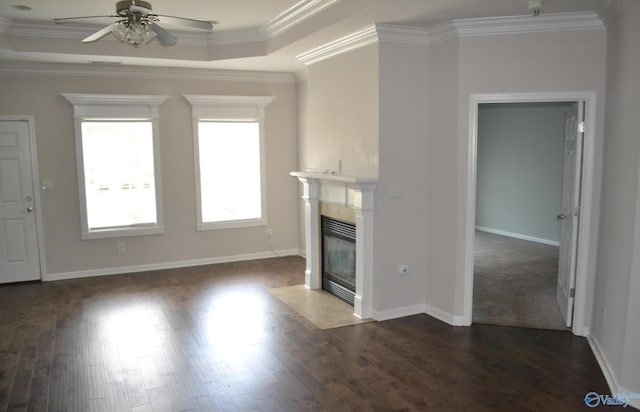 14 Moore Farm Cir NW Unit 14, Huntsville, AL 35806 - unfurnished living room with a ceiling fan, a tiled fireplace, dark wood-type flooring, crown molding, and a tray ceiling
