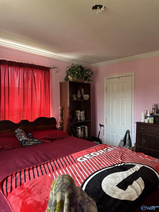 bedroom featuring crown molding