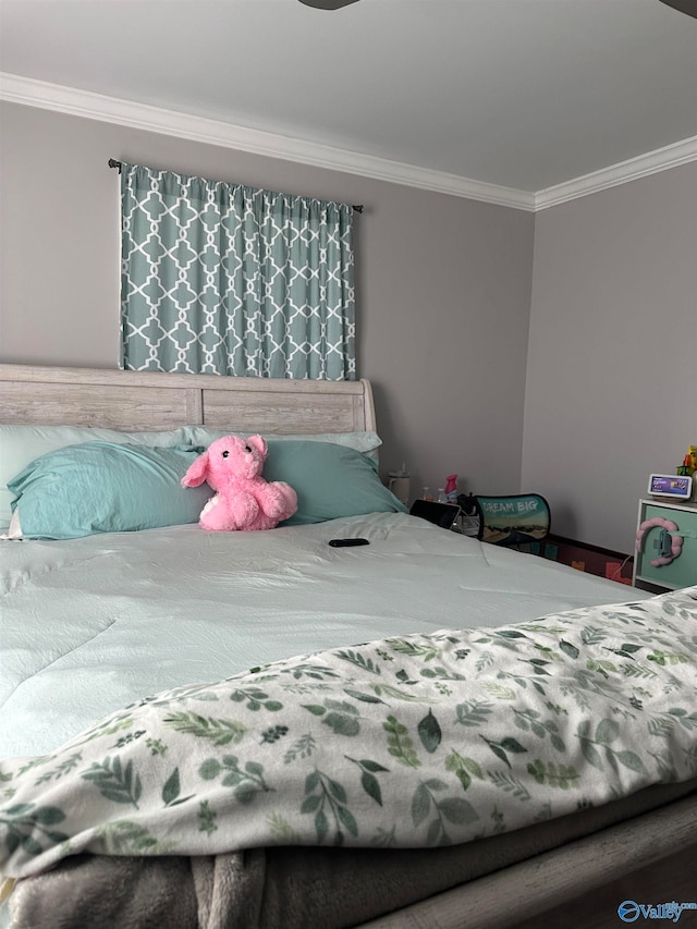 bedroom featuring crown molding