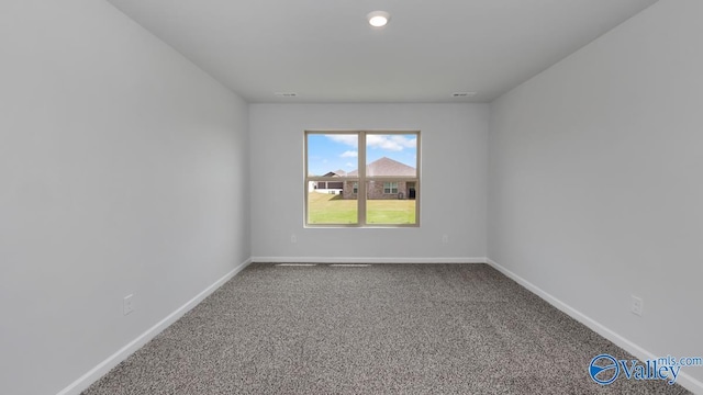 empty room with carpet flooring