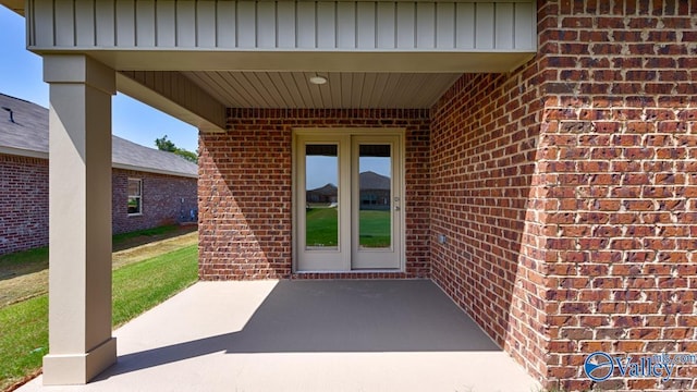 entrance to property featuring a patio area