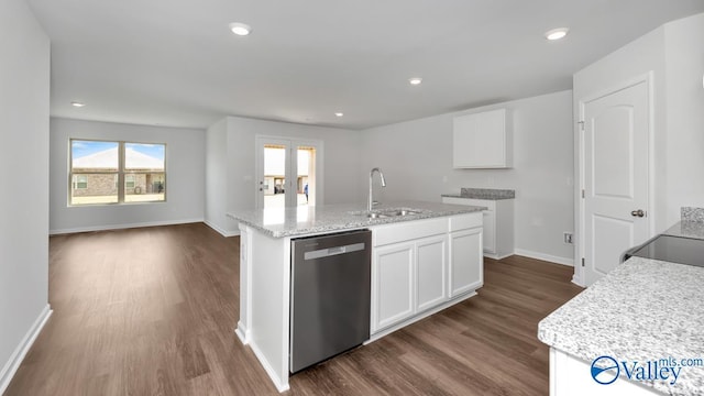 kitchen featuring dark hardwood / wood-style floors, white cabinetry, dishwasher, sink, and a kitchen island with sink