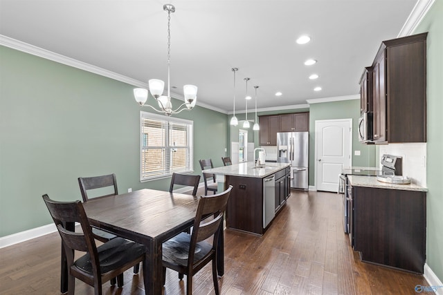 dining area with recessed lighting, crown molding, baseboards, and dark wood-style flooring