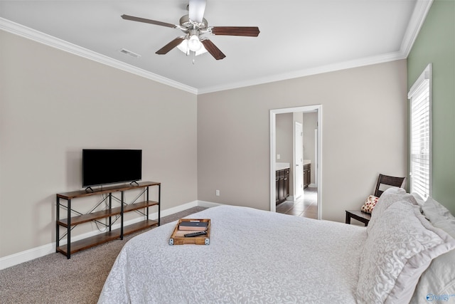 carpeted bedroom featuring visible vents, baseboards, a ceiling fan, and crown molding