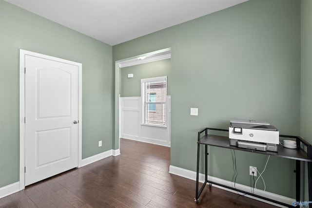 interior space featuring dark wood-type flooring and baseboards