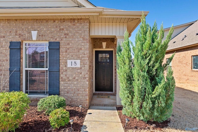 entrance to property with brick siding