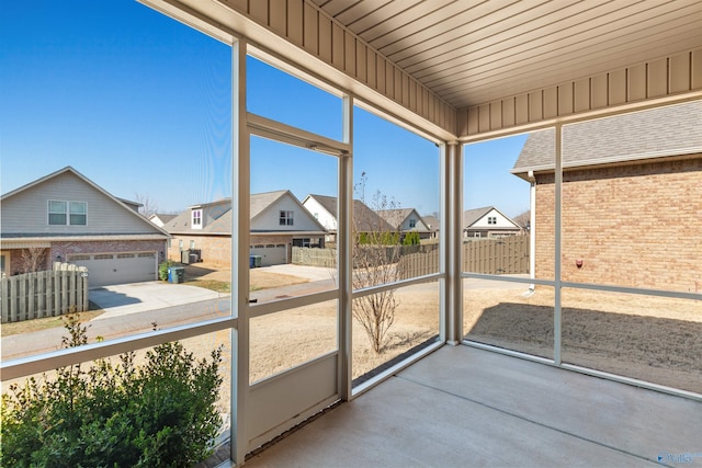 unfurnished sunroom featuring a residential view