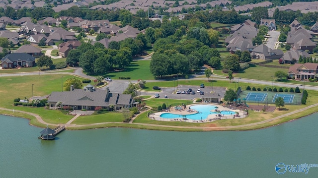 birds eye view of property featuring a residential view and a water view