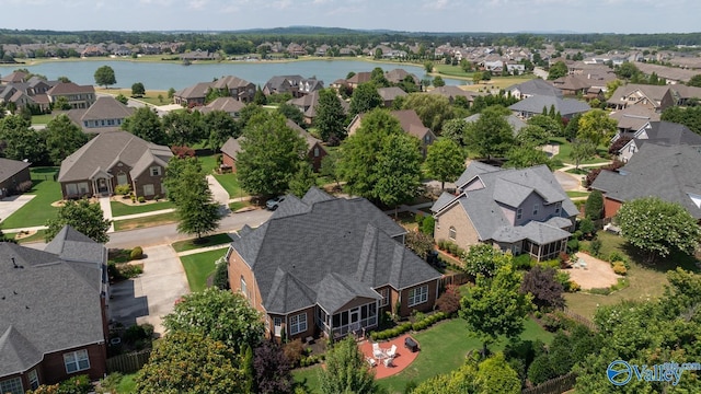 bird's eye view featuring a residential view and a water view