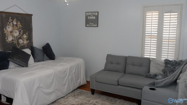 bedroom featuring wood finished floors