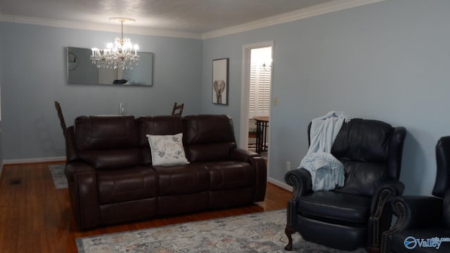 living area featuring baseboards, a notable chandelier, wood finished floors, and ornamental molding
