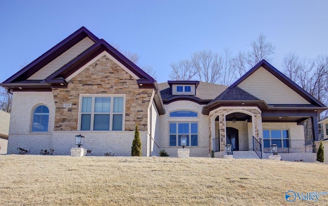 view of front of home with a front lawn and covered porch