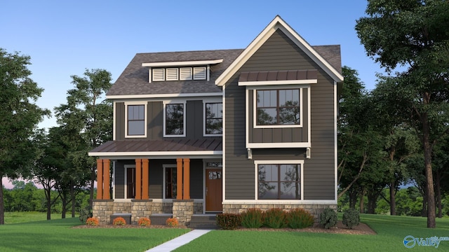 view of front facade with covered porch, a standing seam roof, metal roof, a front lawn, and stone siding