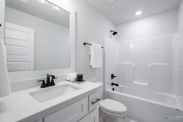 bathroom featuring toilet, shower / bath combination, and vanity