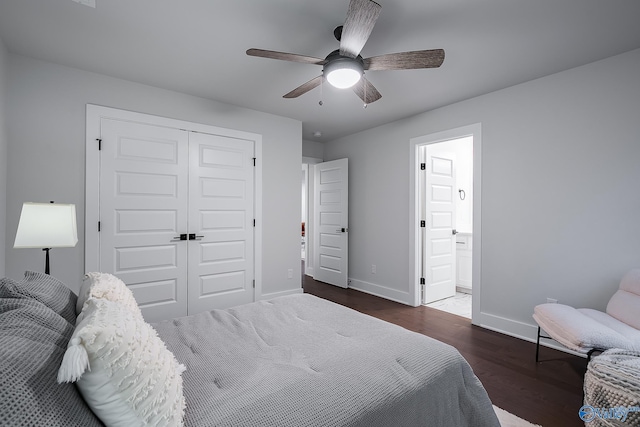 bedroom featuring connected bathroom, a ceiling fan, baseboards, wood finished floors, and a closet