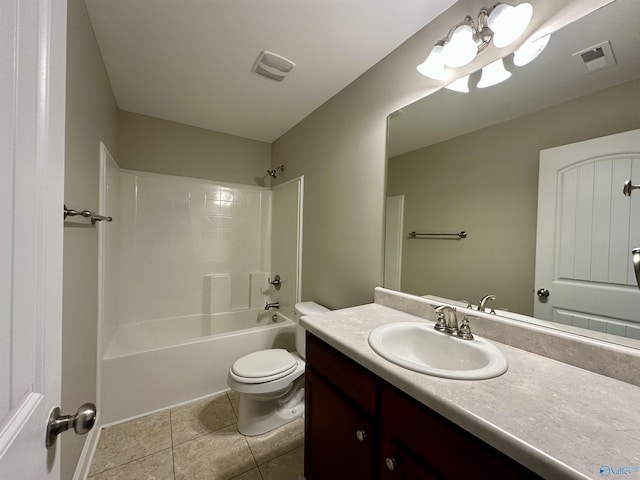 bathroom with toilet, vanity, tile patterned flooring, and visible vents