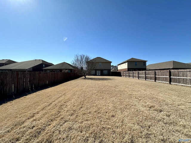 view of yard with a fenced backyard