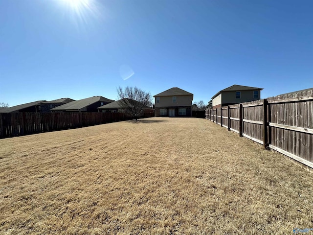 view of yard featuring a fenced backyard